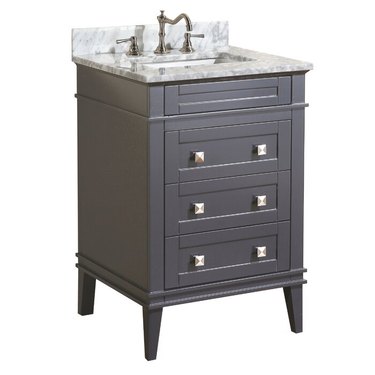 Gray painted small bathroom vanity with geometric knobs and marble countertop