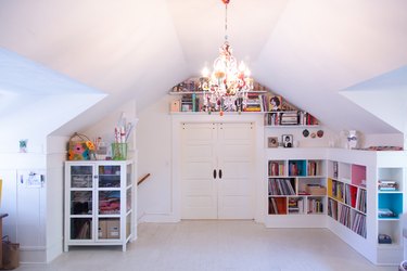 library room featuring bookshelves and shelves of books above the doorway