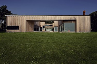 Scandinavian style house with grass in front