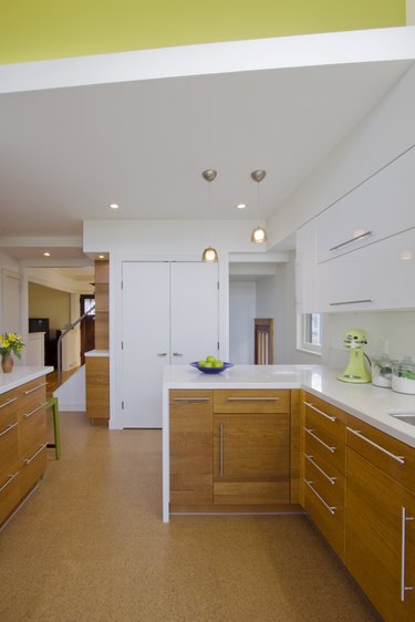kitchen space with wood cabinets and cork flooring