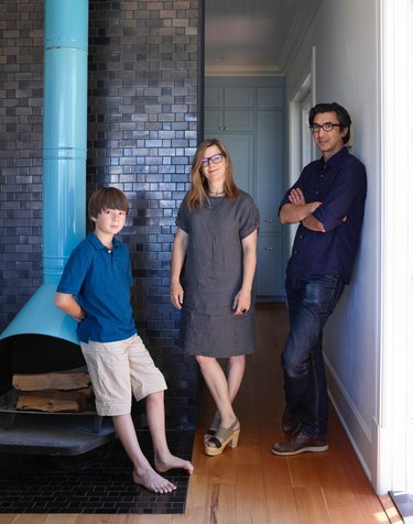 Heath owners with son in their Sausalito home with turquoise firelplace