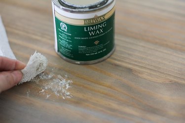 Buffing liming wax onto table