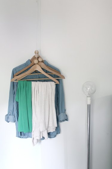 DIY coat hangers that hang from the ceiling for small space