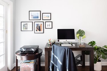 Home office desk with computer and printer