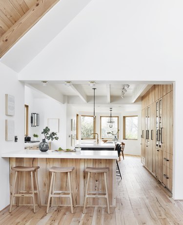 Kitchen island back panel idea with wood to match the floor by Emily Henderson