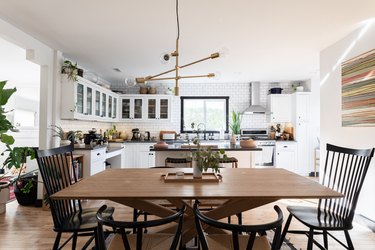 large kitchen with focus on wood dining room table