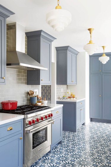 blue kitchen floor with patterned tile and blue cabinets