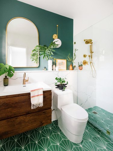 emerald green bathroom with walnut and gold bathroom fittings