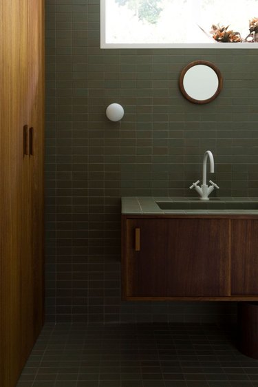 green bathroom idea with ceramic wall and floor tile