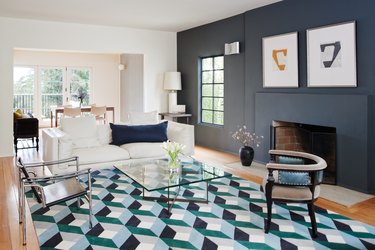 white living room with charcoal color accent wall