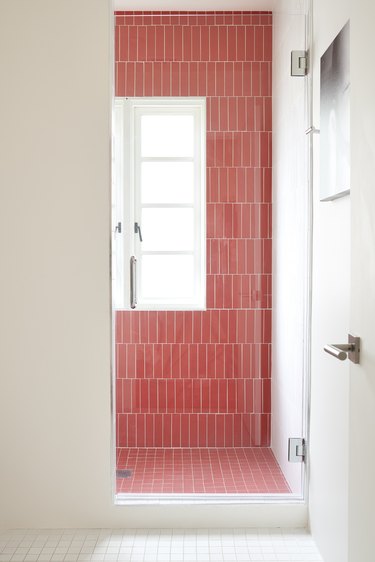 bathroom with red tile shower
