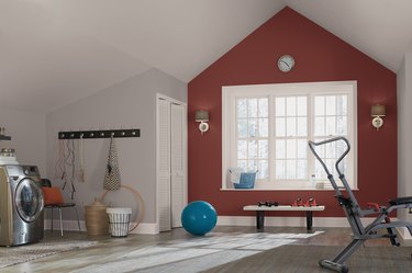 exercise area with deep red accent wall