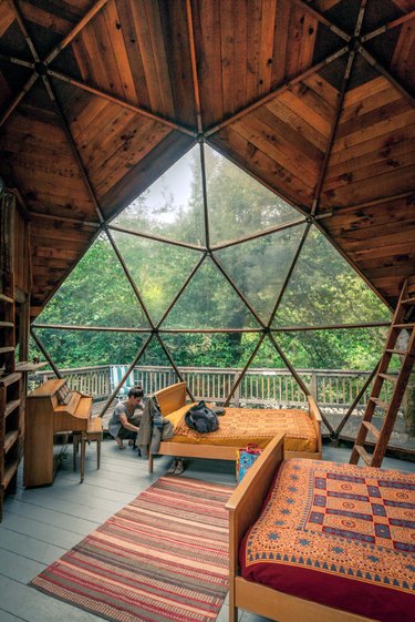 cabin interior with geometric dome roof and windows