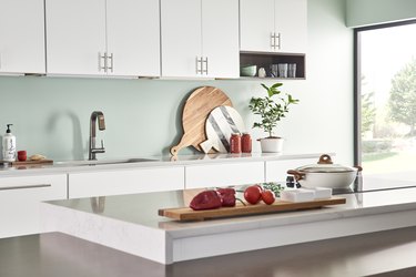 kitchen area with light blue green backsplash