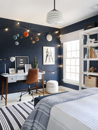 midcentury kids bedroom idea with desk and leather task chair and blue walls