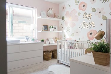 Nursery idea with IKEA crib and floral accent wall