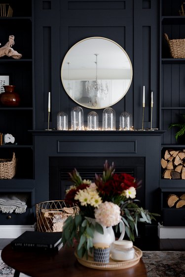 Display of glass cloche on mantel