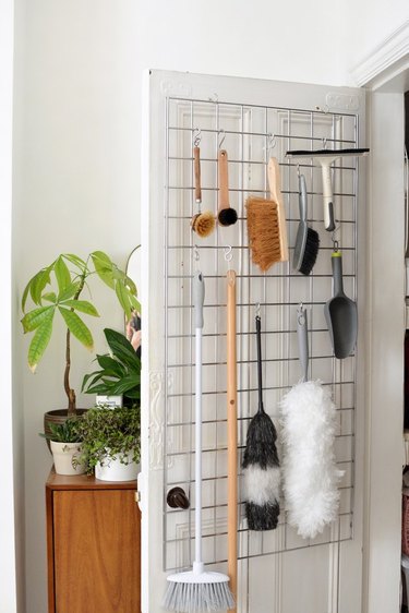 cleaning closet idea with over-the-door storage for essentials