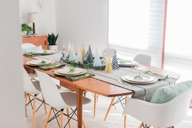 Style the rest of the table with other holiday décor that matches your trees' color palette.