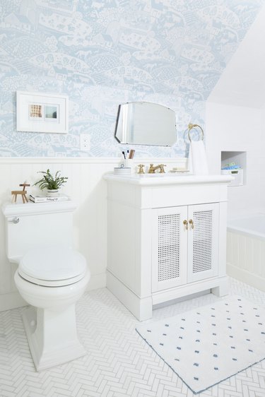 kids bathroom with wallpapered ceiling