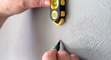 Stud finder in use.