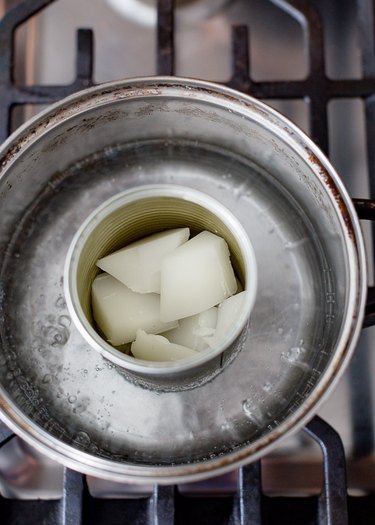 Melting wax in can.