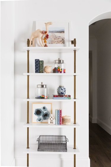 playroom storage idea with art supplies in glass canisters