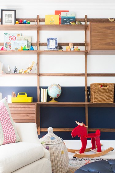 midcentury playroom storage idea with wall-mounted storage unit