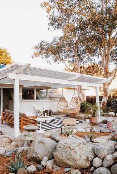 backyard structure with hanging chairs