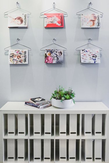 magazines stored on clothing hangers