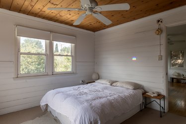 Airy bedroom with ceiling fan