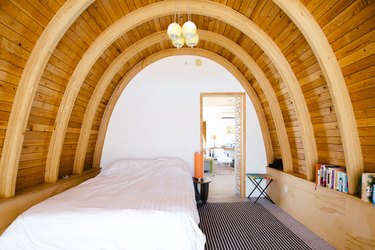 Bedroom with wood curved walls