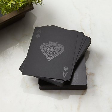 stack of black playing cards