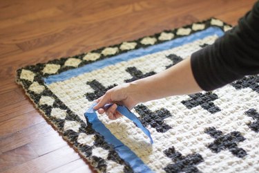 Pulling tape off rug