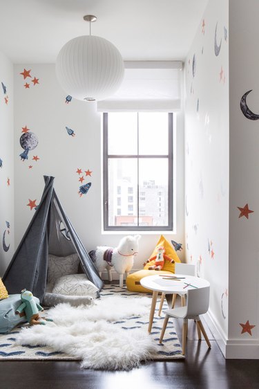 kids playroom idea with Teepee Fort in Playroom of Tribeca Loft by Chango & Co