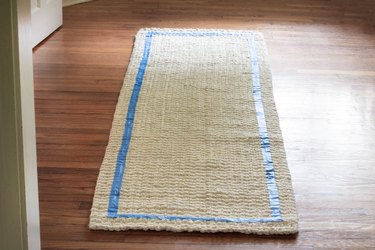 Border taped around edge of rug