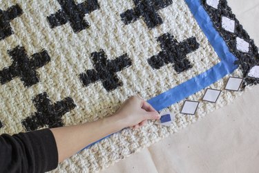 Taping diamond stencil to rug