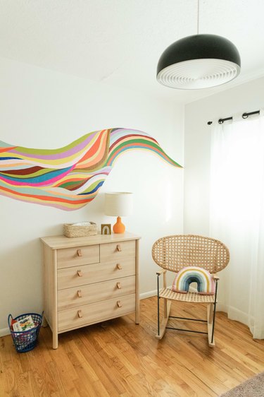 Colorful art adding warmth to a bedroom wall.