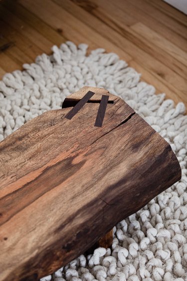 Homemade wood coffee table on rug