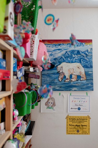 Kids bedroom with bookshelf and art