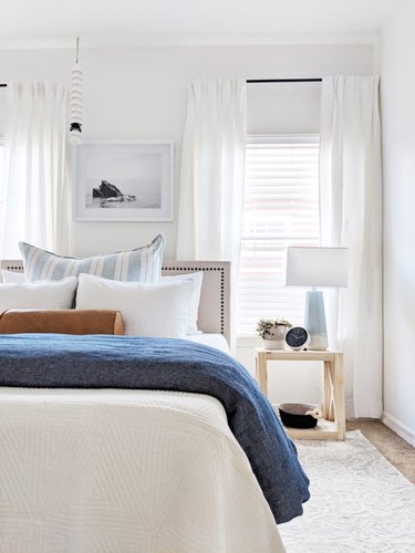 coastal bedroom with white and blue color scheme