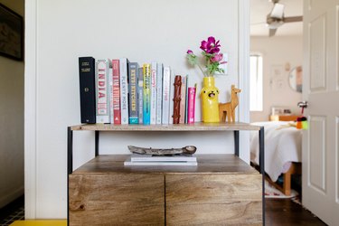 console with books and vase