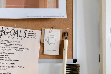 corkboard with papers and tools