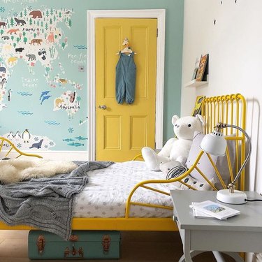 yellow kids bedroom idea with painted door and matching bed frame