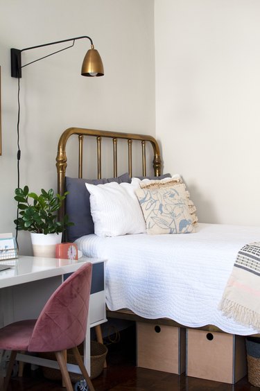 Bed with brass headboard