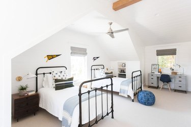 white shiplap walls in neutral boys bedroom idea with matching twin beds