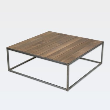 Square minimal coffee table with black metal base and dark wood top