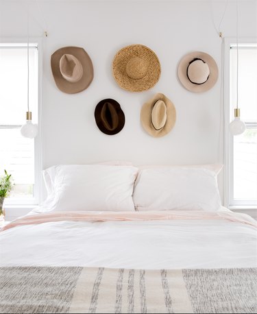 teen bedroom idea with hats displayed on wall above bed