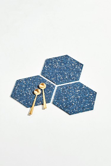 three blue speckled trivets