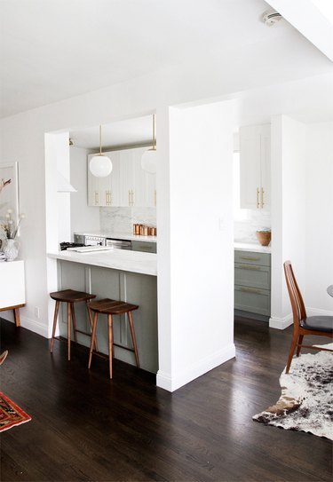 galley kitchen with green cabinets